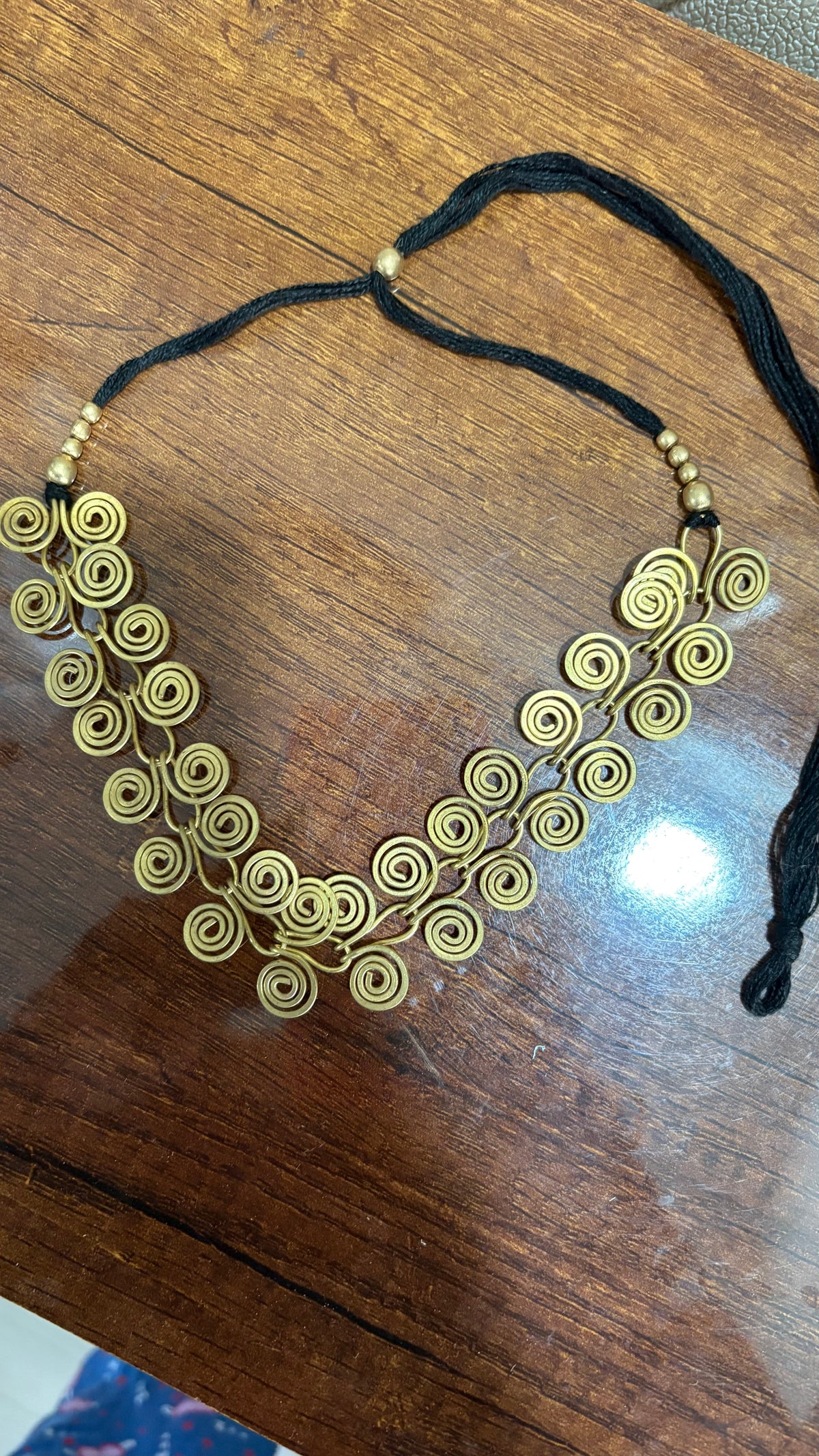 Gold spiral necklaces